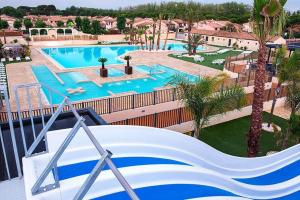 Maisons de vacances Maison avec piscine chauffee de Paques a la toussaint TAMARIS acces animation & parc aquatique DE juin a fin septembre : photos des chambres