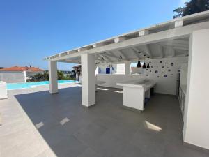 Portoheli Villa Downtown, Pool & Port view