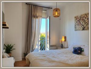Appartements Maison du Bonheur l Art de vivre a la francaise Logement entier avec parking : photos des chambres