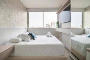 Distrito 90 - Estudios y Apartamentos para vacaciones y viajes de negocio