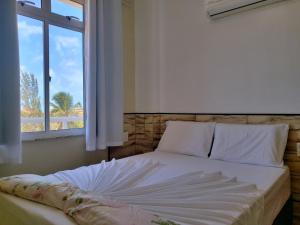 2 QUARTOS em CONDOMÍNIO TRANQUILO com PISCINA Estacionamento coberto – PARQUINHO para CRIANCAS - Cozinha Completa, VENTILADO, nascente, AR CONDICIONADO – 800m da praia do PORTO DAS DUNAS e BEACH PARQUE - Ceará