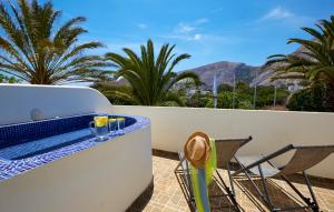 Deluxe Triple Room with Outdoor Jetted Tub room in Hermes Hotel