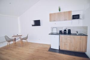 Appartements Studios Lsquare-Residence : photos des chambres