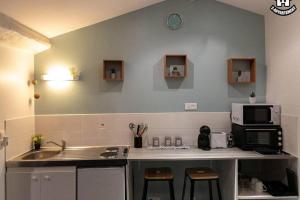 Appartements La pensee - centre ville - WIFI- parking : photos des chambres