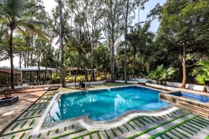 SaffronStays Foresta by the Lake - 6BR veg-only pool estate with lake views, lawns, gazebo & sports court in Kamshet