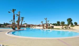 Maisons de vacances Maison avec piscine chauffee de Paques a la toussaint TAMARIS acces animation & parc aquatique DE juin a fin septembre : photos des chambres