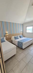 Rubino Apartments a 100 passi dal mare - P r a t u r e c c i Group