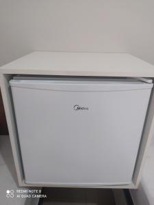 Pousada Quarto com ventilador,ar frigobar e garagem