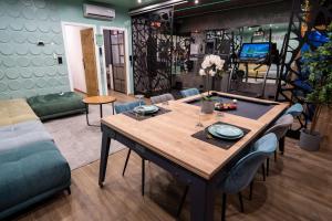 Appartements Capsule Wellness - sauna - balneo - machine de sport privatif - PS5 - 2 chambres : photos des chambres