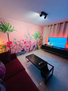 Appartements Pink Tropical Champagne : photos des chambres