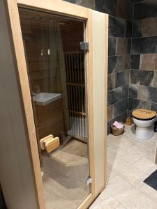 Appartements Charmant logement avec jacuzzi et sauna : photos des chambres