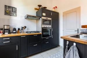 Maison de village façon Loft, avec cour et airco, dans le centre historique