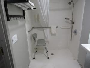 Double Room with Two Double Beds and Chair - Accessible/Non Smoking room in Rodeway Inn
