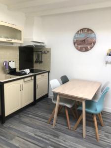 Appartements Appartement Arc en Ciel : photos des chambres