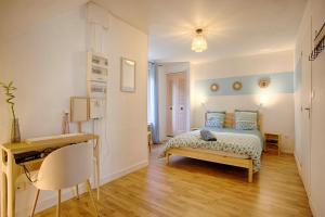 Appartements Le Grand Appart' proche commerces : photos des chambres