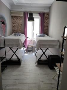 Quadruple Room with Private Bathroom room in Hostal Hispalense