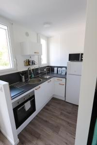 Appartements Studio tout confort - Climatisation, parking, wifi : photos des chambres