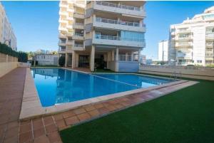 Apartamento Aquarium Park, 1ª linea de playa, piscina privada, aire acondicionado y wifi de alta velocidad