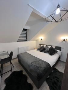 Appartements Appartement haut de gamme avec Jacuzzi Champagnole : photos des chambres