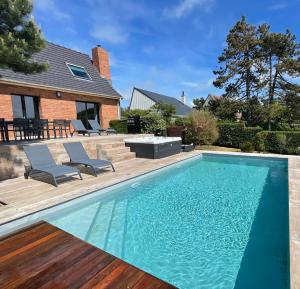 Villas Superbe maison avec piscine et jacuzzi dans les dunes : photos des chambres