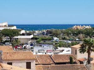 Studio Vue mer panoramique, piscine Port Vénus village naturiste