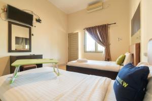 Urbanview Hotel Nugraha Palembang by RedDoorz