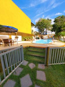 Casa de praia com piscina e playground