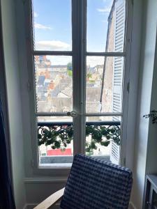 Appartements ☆ Sur les toits de Blois ☆ T2 avec vue Chateau : photos des chambres