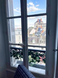 Appartements ☆ Sur les toits de Blois ☆ T2 avec vue Chateau : photos des chambres