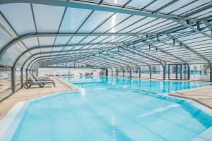 Chalets Vacances a 6 dans un Domaine avec piscine chauffee : photos des chambres