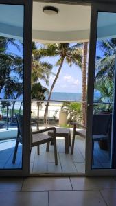 Rosy Sea Front Beach Condo