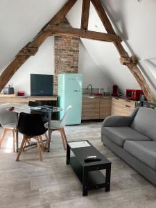 Appartements Au cochon qui rit : photos des chambres