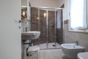 Standard Triple Room with Balcony and Partial Lake View room in Hotel Firenze