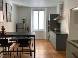 Appartements Appartement avec place de parking et box velos : photos des chambres