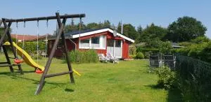 Treeneglück - gemütliches Ferienhäuschen mit Garten und Strandkorb - Hünning