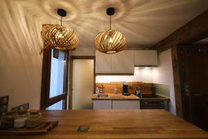 Appartements Au coeur du village : photos des chambres