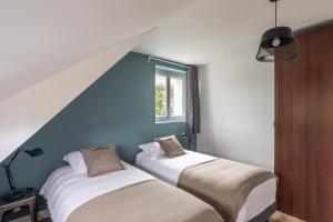 Maisons de vacances Green Lodge - Piscine chauffee et grand Jardin a proximite des Plages de Pleneuf Val-Andre : photos des chambres