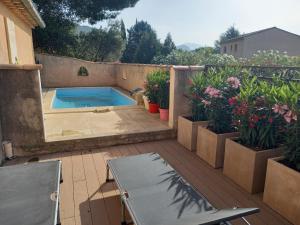 Sejours chez l'habitant AU BONHEUR, climatisation, cuisine, Piscine : photos des chambres