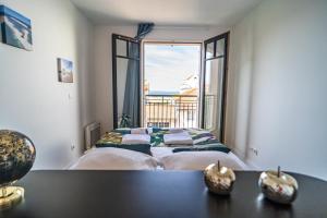 Appartements Down Center - Incroyable vue mer proche plage : photos des chambres