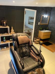 Appartements Le Cosily jacuzzi et sauna privatif : photos des chambres