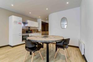 Appartements LA MANUFACTURE - TOPDESTINATION-BOURG - Centre ville - Classe 3 etoiles : photos des chambres