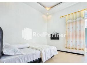 Griya Rahayu Guesthouse Mitra RedDoorz near Jatim Park 2 Batu