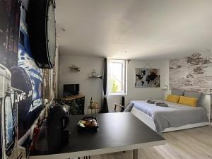 Appartements Le petit atelier - Studio - WIFI - Coeur de ville - Parking : photos des chambres