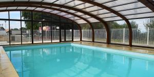 Maisons de vacances SUPERBE CHALET AVEC PISCINE CHAUFFEE Juillet et Aout : photos des chambres