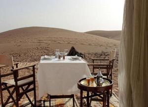 Erg Lihoudi Luxury desert camp with Camel ride, meals & sandboarding
