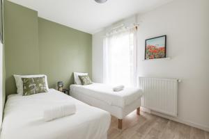 Appartements Sunny Garden by Plaza - Proche Disneyland Paris : photos des chambres