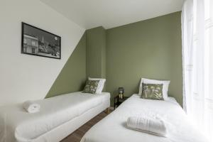 Appartements Sunny Garden by Plaza - Proche Disneyland Paris : photos des chambres