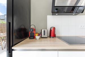 Appartements Sunny Garden by Plaza - Proche Disneyland Paris : photos des chambres