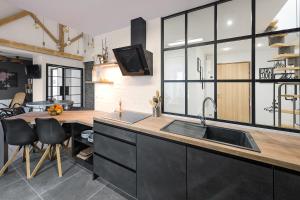 Appartements l'authentique en hyper centre ville : photos des chambres