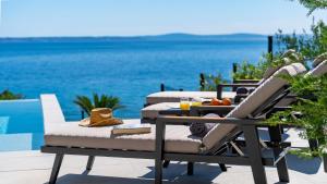 Seaview Villa ABA with 38sqm heated infinity pool, 4 bedrooms, Media room, 150m from sea